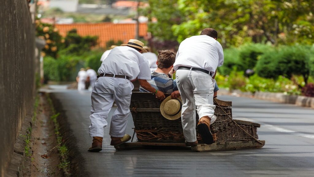 Madeira island attractions, People trying Monte Toboggan Sledge ride