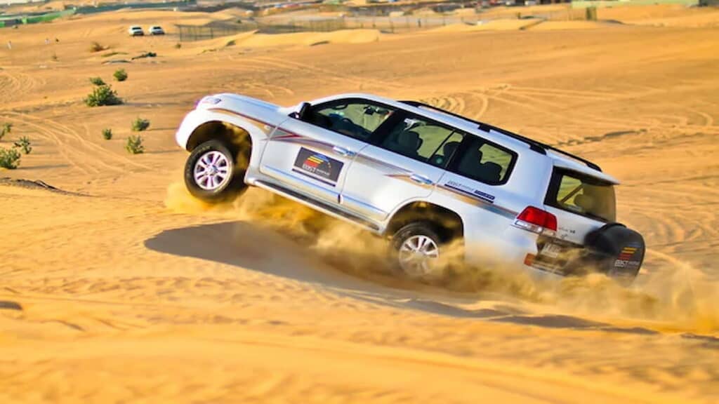 Dune bashing in Dubai, safari car in desert