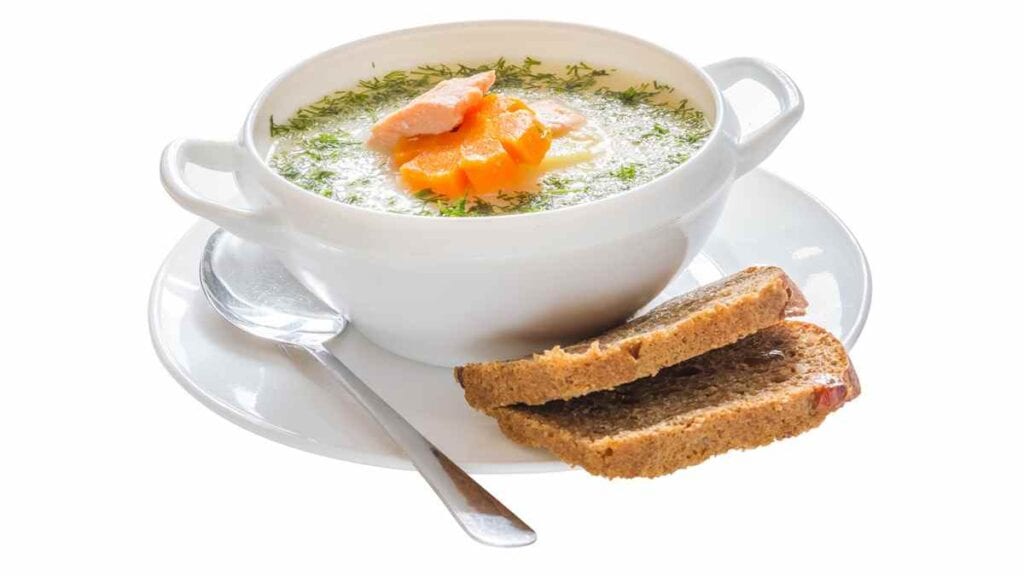 Traditional Finnish foods, fishy Salmon Soup served with bread
