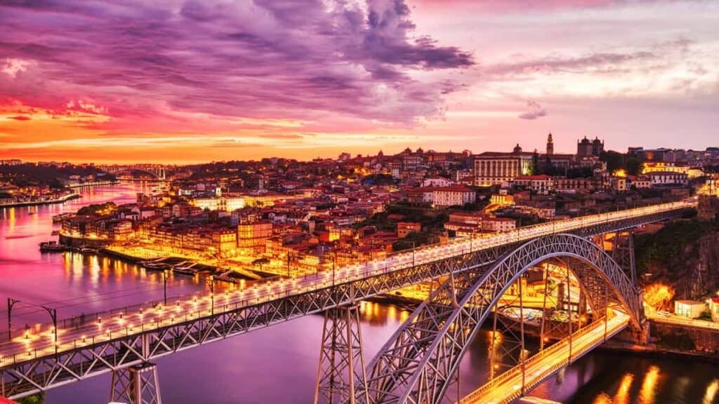 Sightseeing in Porto Portugal, sunset over the bridge
