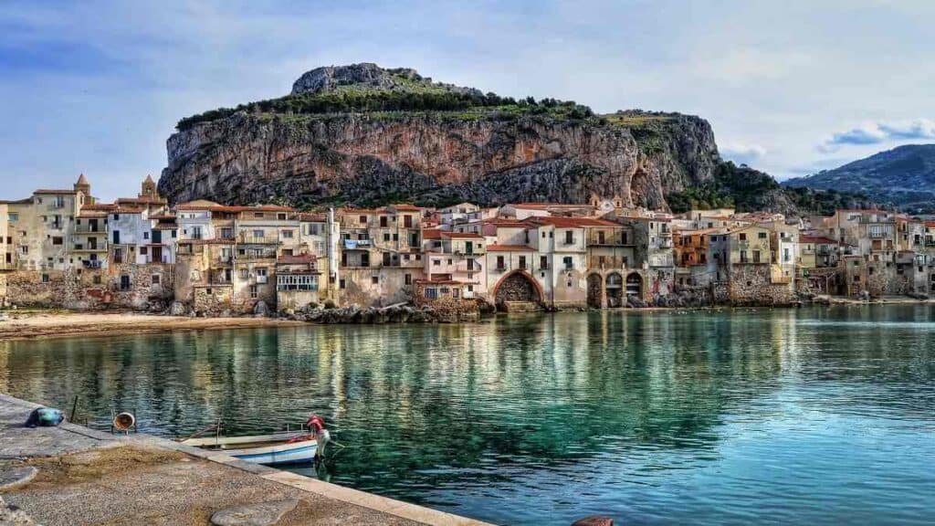 Towns and cities in Sicily, medieval Cefalu waterfront with Norman cathedral and beach