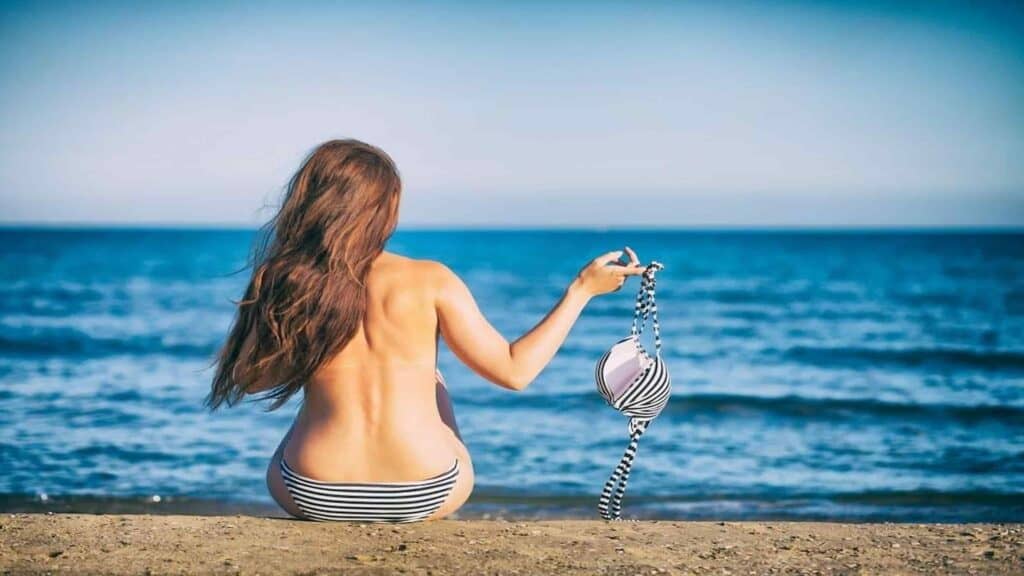 Clothing optional beaches in the US, Woman on a beach