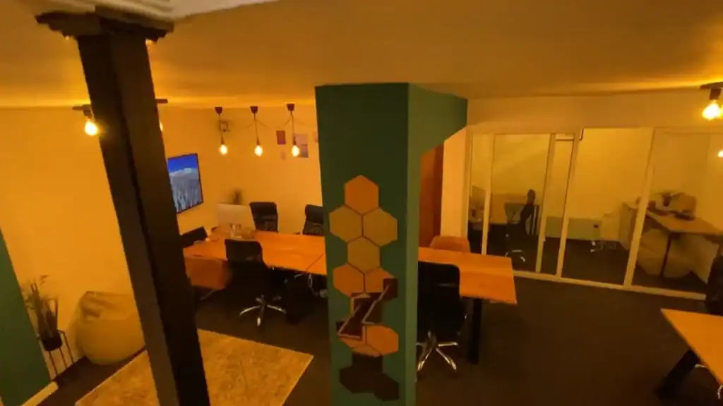 Modern Altspace coworking space with desks and ambient lighting in Bansko in summer