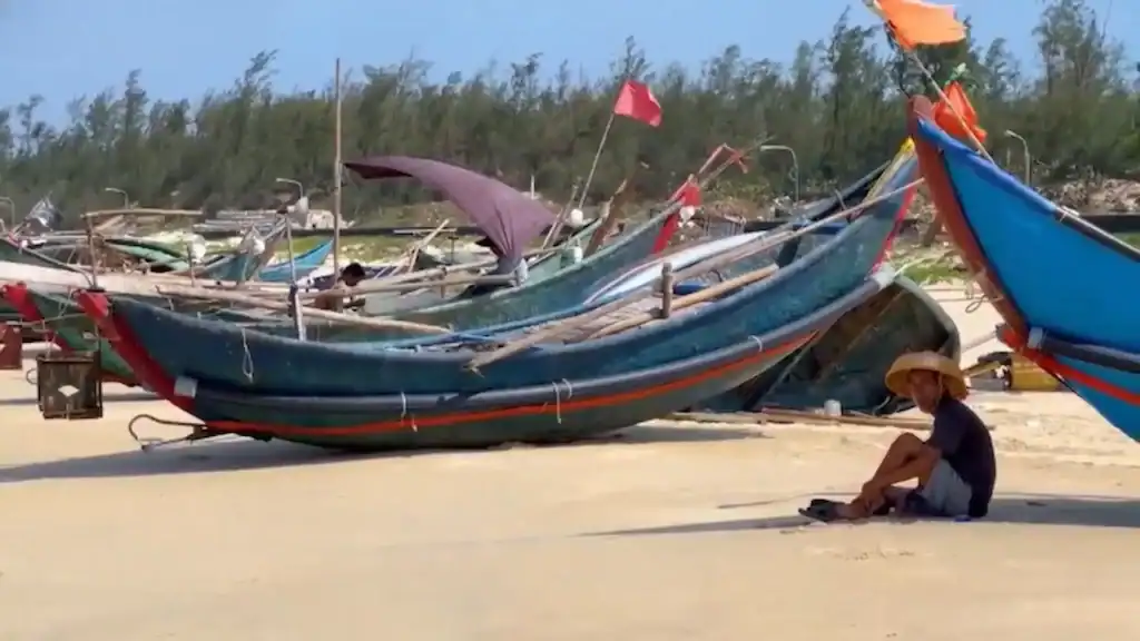 Traditional fishing boats on Tam Thanh Beach provide cheap alternative to Hoi An tourist-focused riverboat experiences