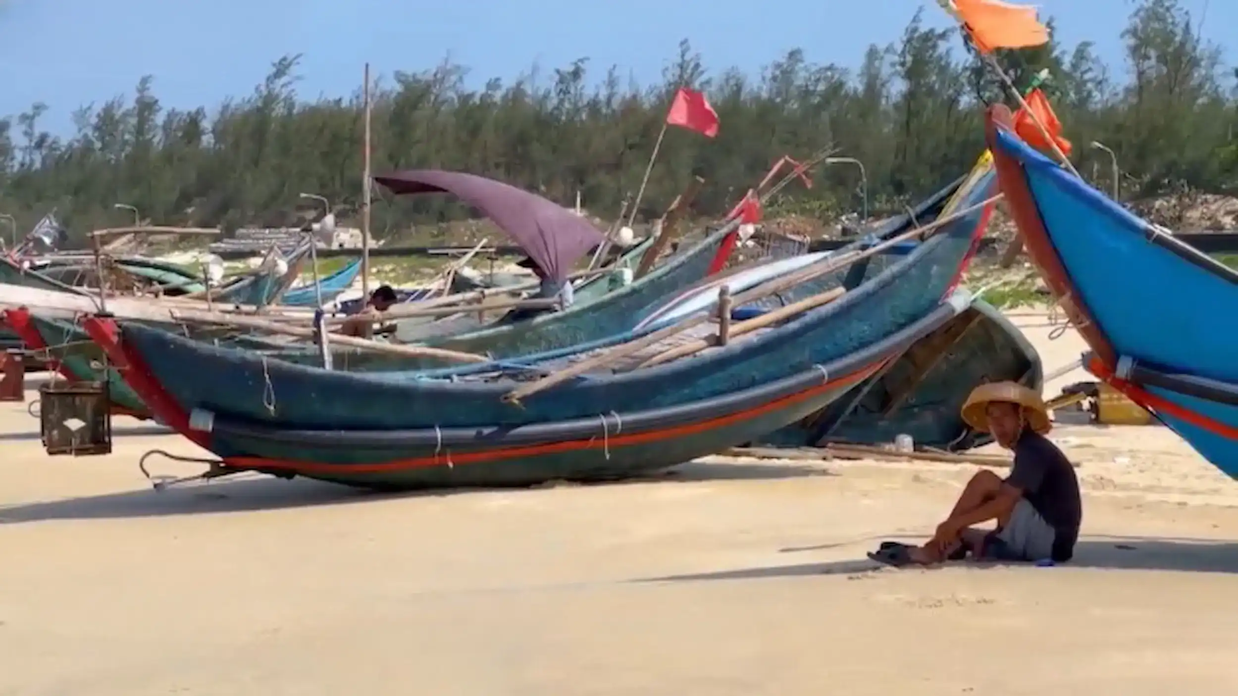 Traditional fishing boats on Tam Thanh Beach provide cheap alternative to Hoi An tourist-focused riverboat experiences