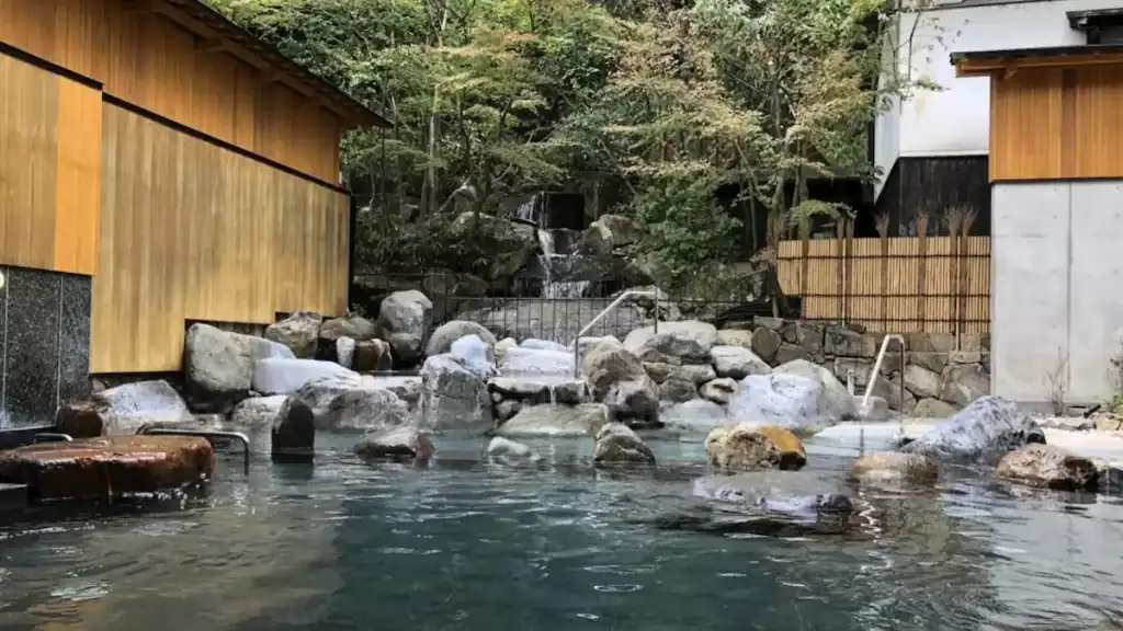 one night in Kinosaki Onsen - Goshonoyu Onsen outdoor public hot spring bath with natural rocks and waterfall
