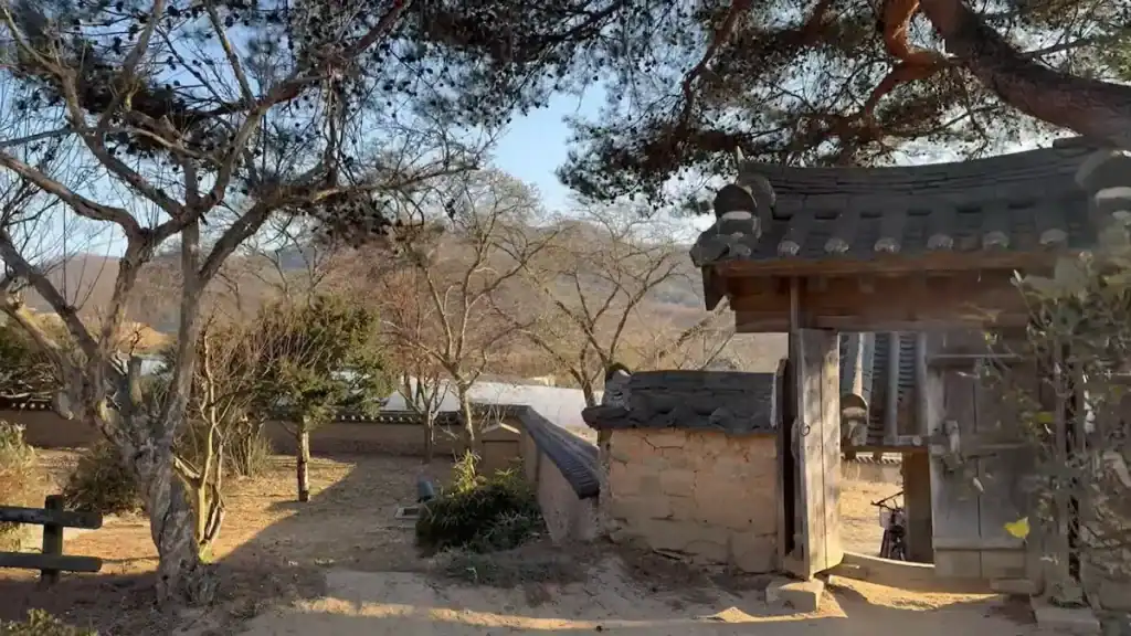 Andong vs Gyeongju traditional Korean hanok house at Hahoe Folk Village in Andong with curved tile roof and courtyard