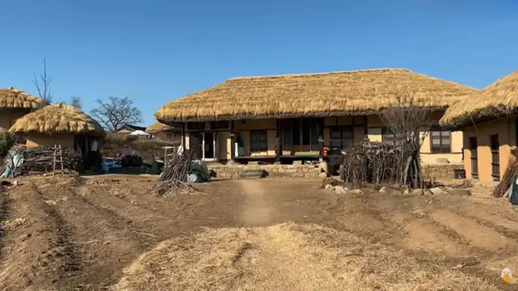 Andong Hahoe Village traditional Korean thatched roof houses with straw roofs mud walls wooden pillars and dirt courtyard