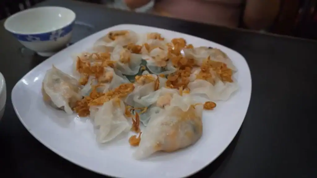 Hue street food vs Hoi An showcased through white rose dumplings topped with crispy shallots