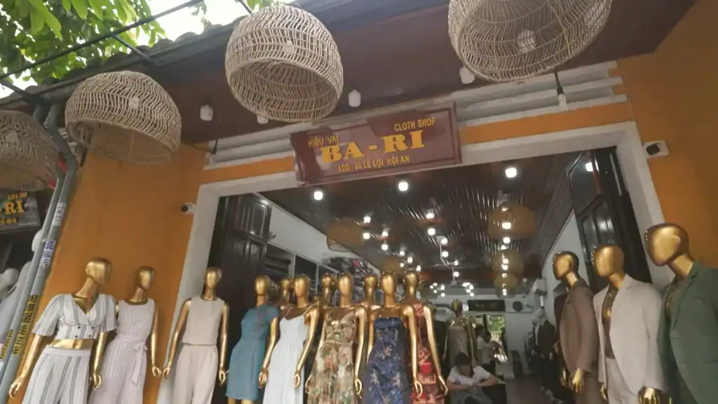 Hoi An tailors display colorful garments on mannequins, perfect for exploring how many days in Hoi An you need.