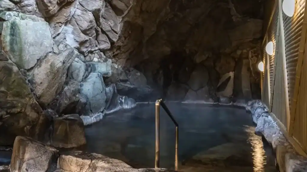 is Kinosaki Onsen worth it - Ichino Yu cave-style hot spring bath with natural rock walls and steaming water
