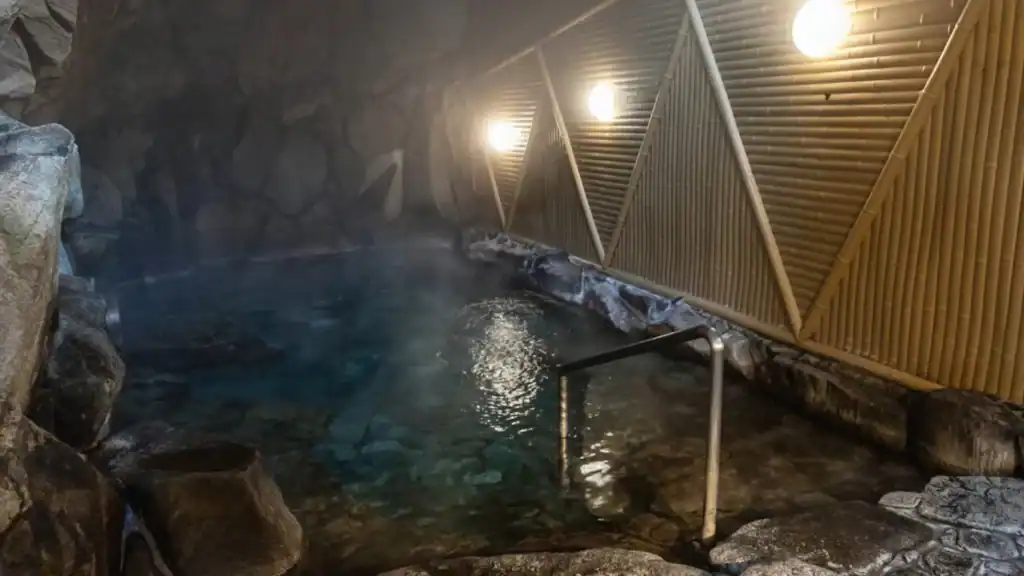 Ichino Yu's atmospheric cave bath with steaming mineral-rich water