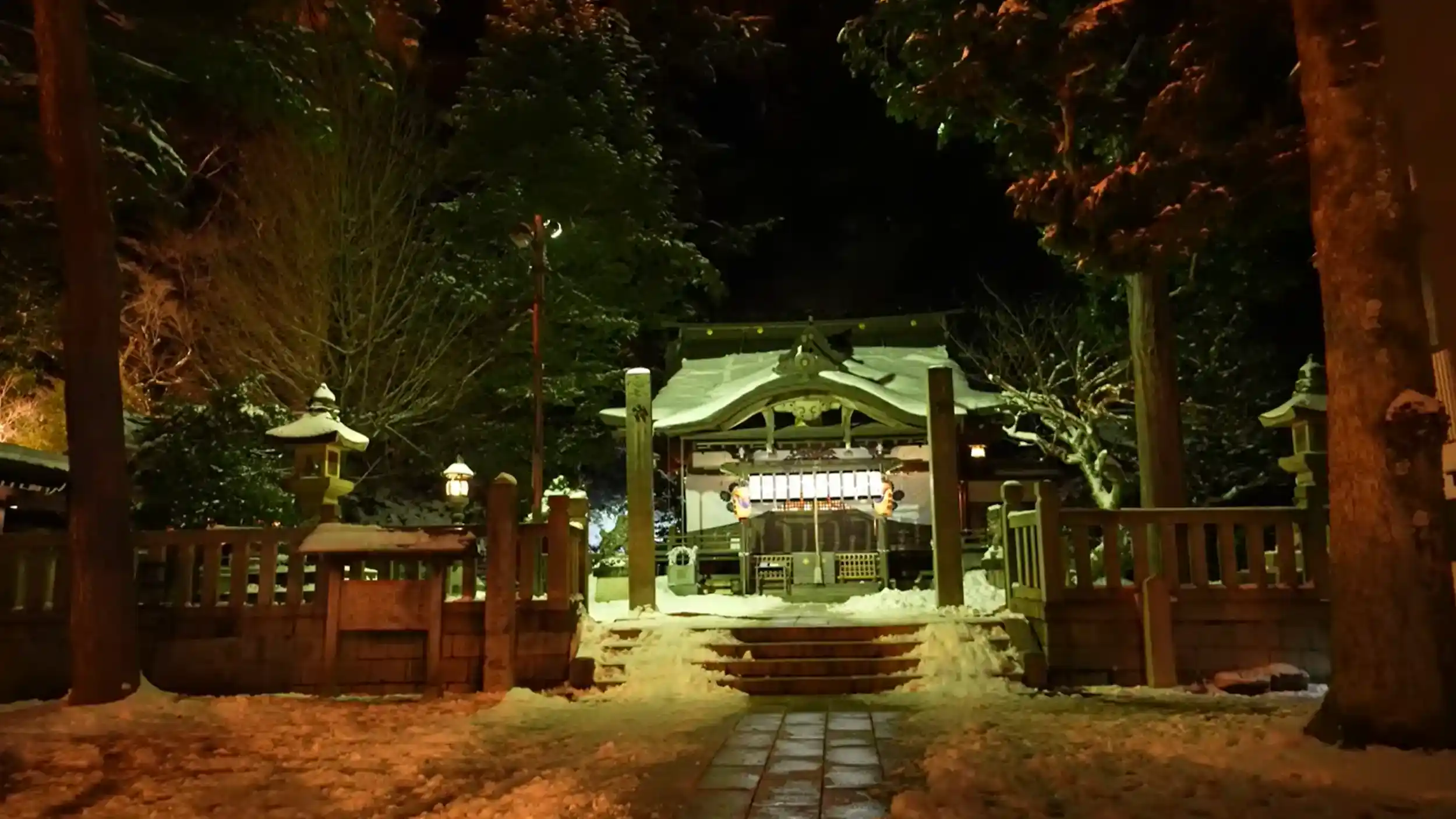 is Kinosaki Onsen worth it - snow-covered shrine illuminated at night in peaceful winter setting