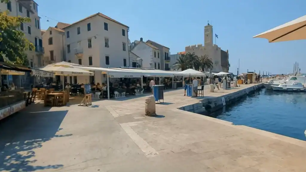 Vis Island remote work at Komiza harbour with waterfront cafes and marina views