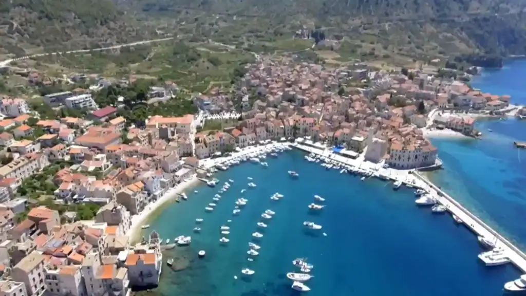 Aerial view of bay with boats and town