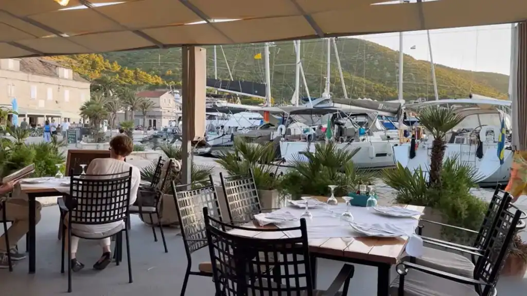 Vis Island remote work at Konoba Vatrica Restaurant with harbor views and laptop workspace