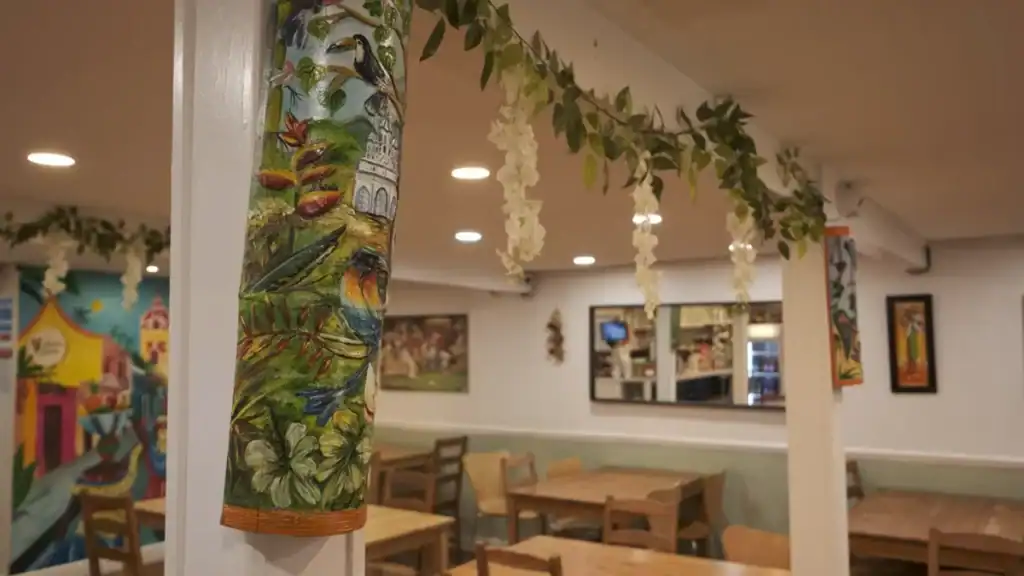 La Barra Elephant and Castle latin restaurants interior with tropical painted columns and floral decorations