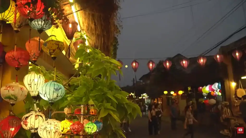 Hue street food vs Hoi An cultural atmosphere with colorful lanterns illuminating ancient town streets