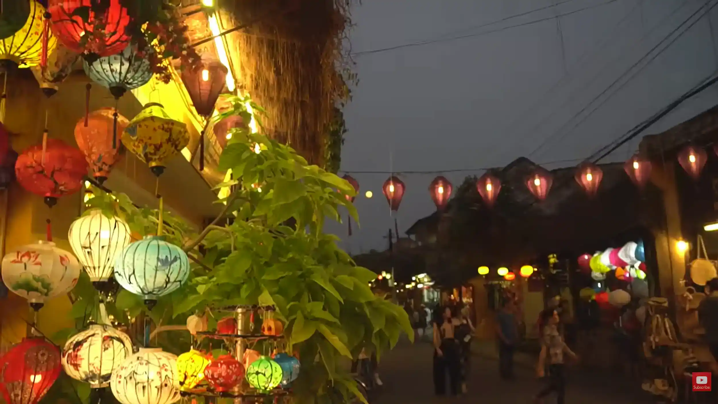 Hue street food vs Hoi An cultural atmosphere with colorful lanterns illuminating ancient town streets