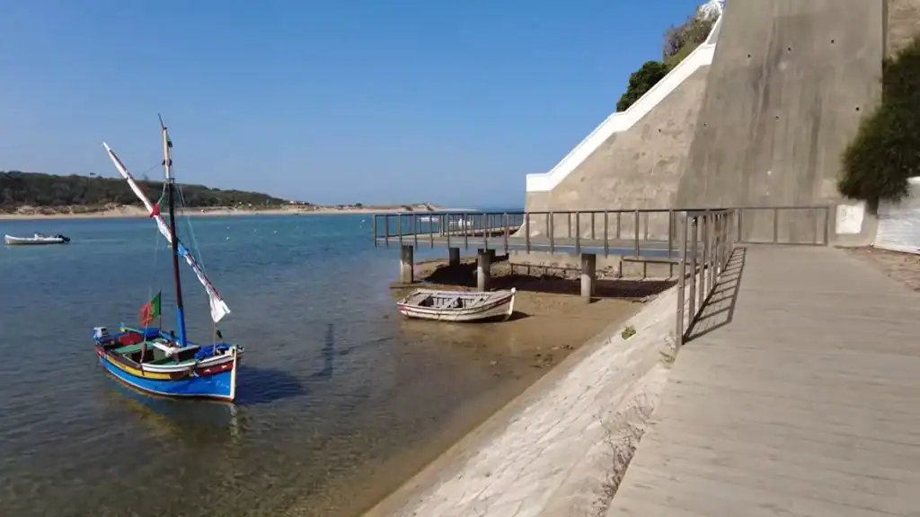 Where to Stay in Milfontes near the coastal path with traditional fishing boats and estuary