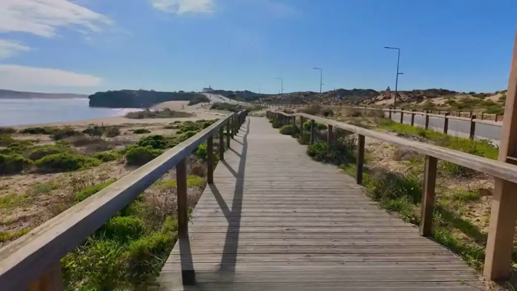 Where to Stay in Milfontes near wooden boardwalk with coastal dunes and beach views