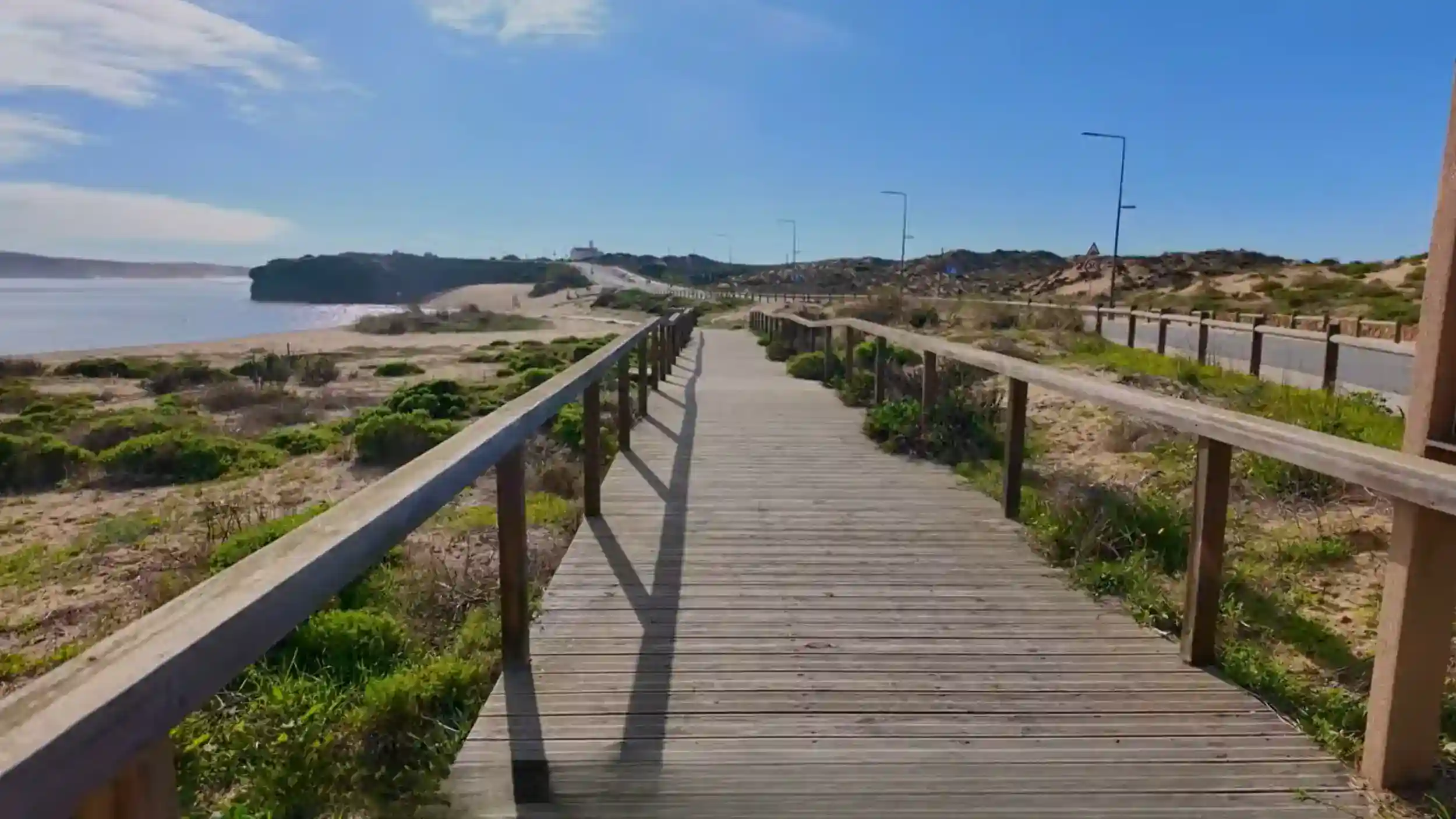 Where to Stay in Milfontes near wooden boardwalk with coastal dunes and beach views