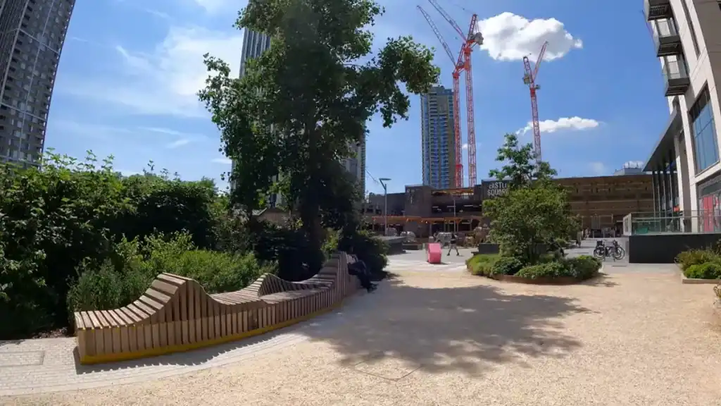 Open public space with seating and greenery