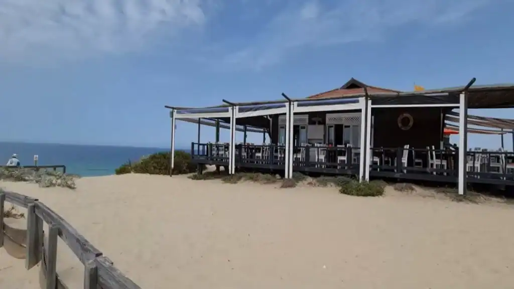 Pego beach Comporta with covered dining terrace overlooking Atlantic Ocean and sandy dunes