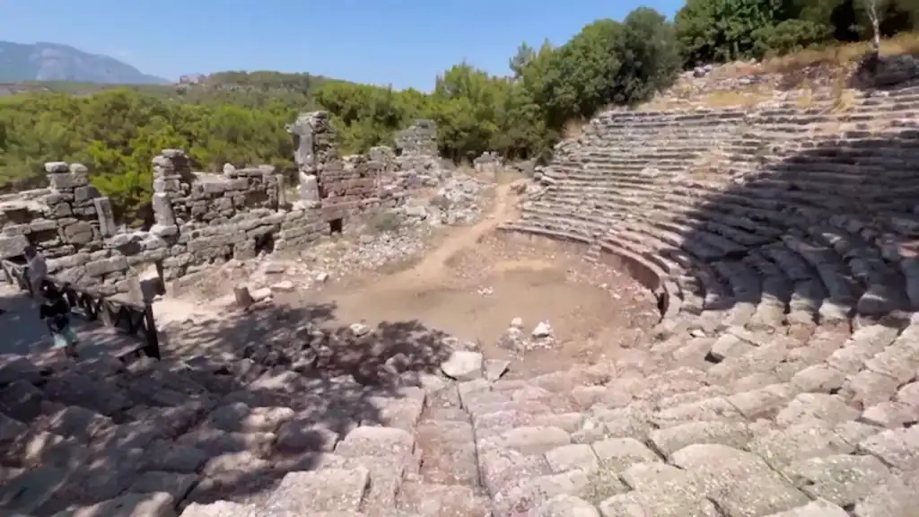 Olympos day trip to Antalya Phaselis ruins with ancient amphitheater and stone seating