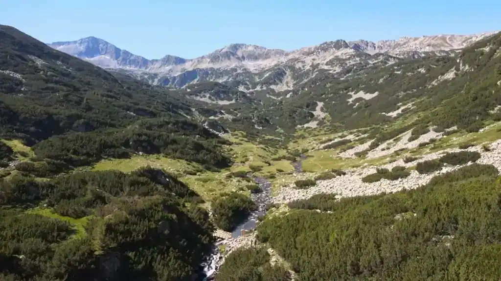 Bansko year round outdoor activities in nearby Pirin National Park mountain valley landscape
