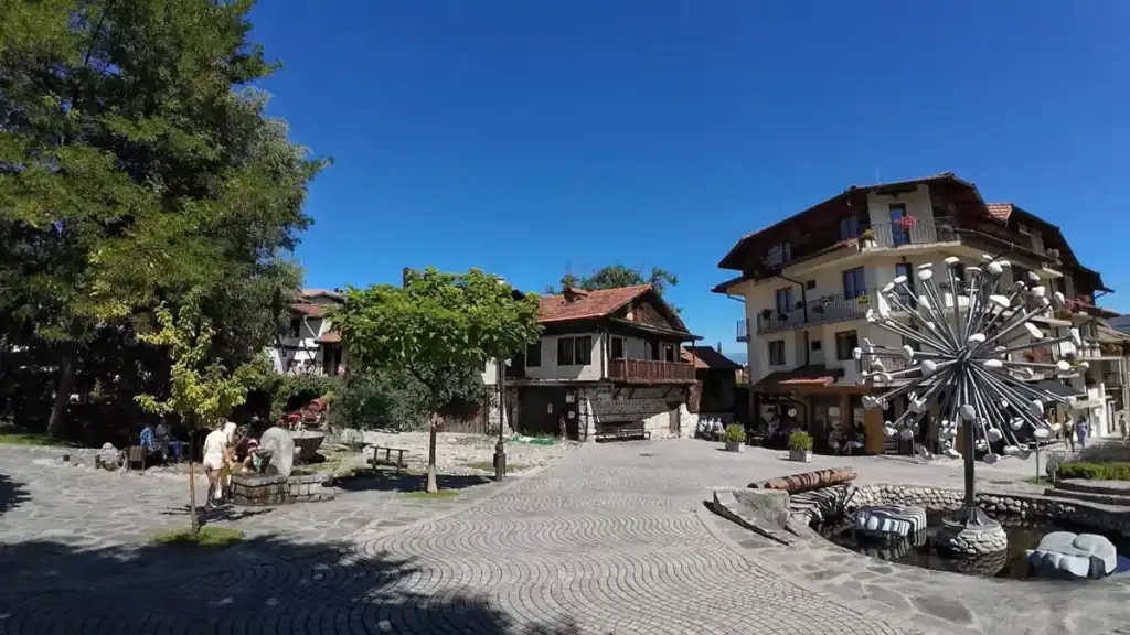 Bansko year round appeal shown in summer old town square with traditional buildings