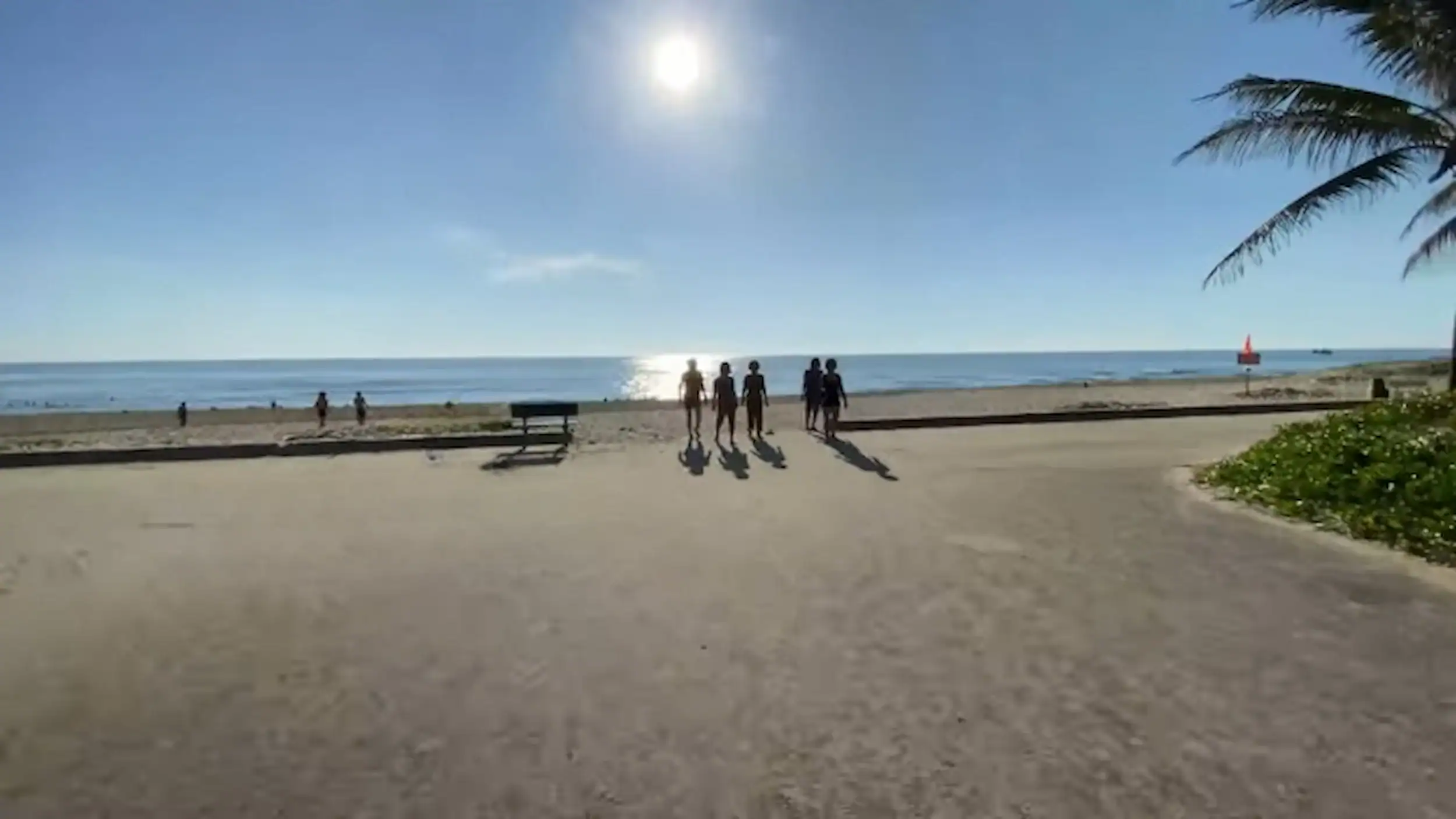 Tam Thanh Beach promenade at sunset comparing Tam Ky vs Hoi An with visitors enjoying ocean views