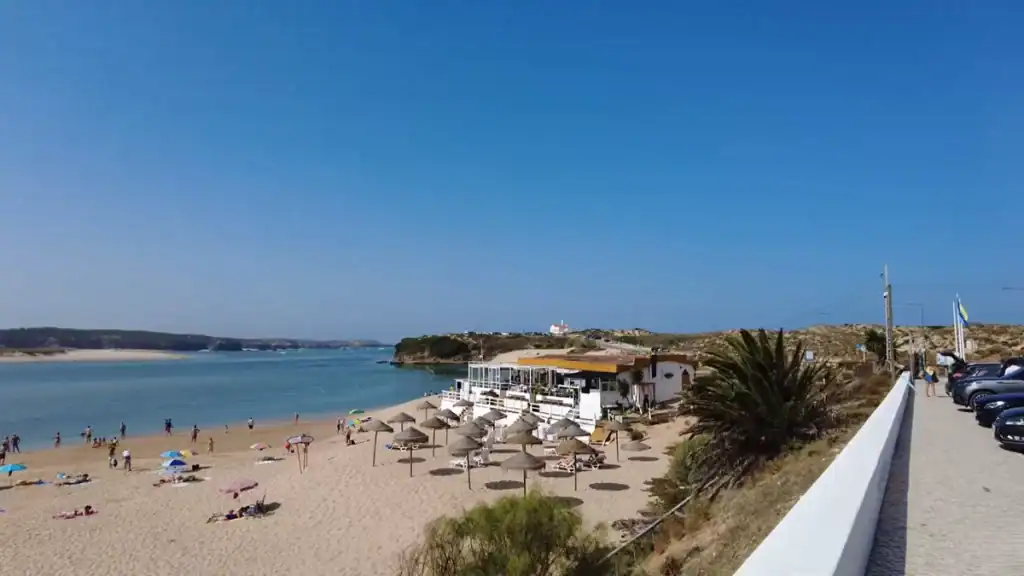 Walking to beach along promenade using Milfontes as a base with estuary views