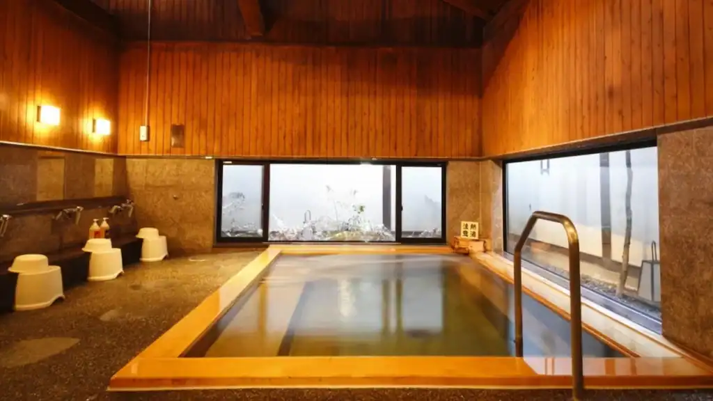 one night in Kinosaki Onsen - Yanagiyu indoor hot spring bath with wooden interior and zen garden view