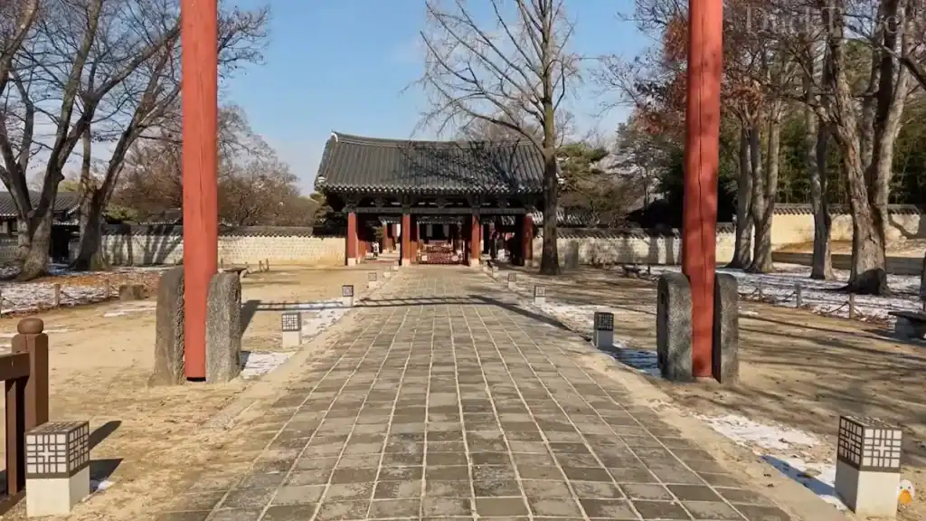Gyeonggijeon Shrine in Jeonju with red painted wooden pillars stone pathway and tile roofed main hall structure