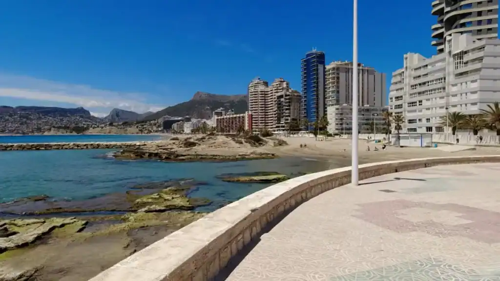 High rise hotels dominating the beachfront skyline.