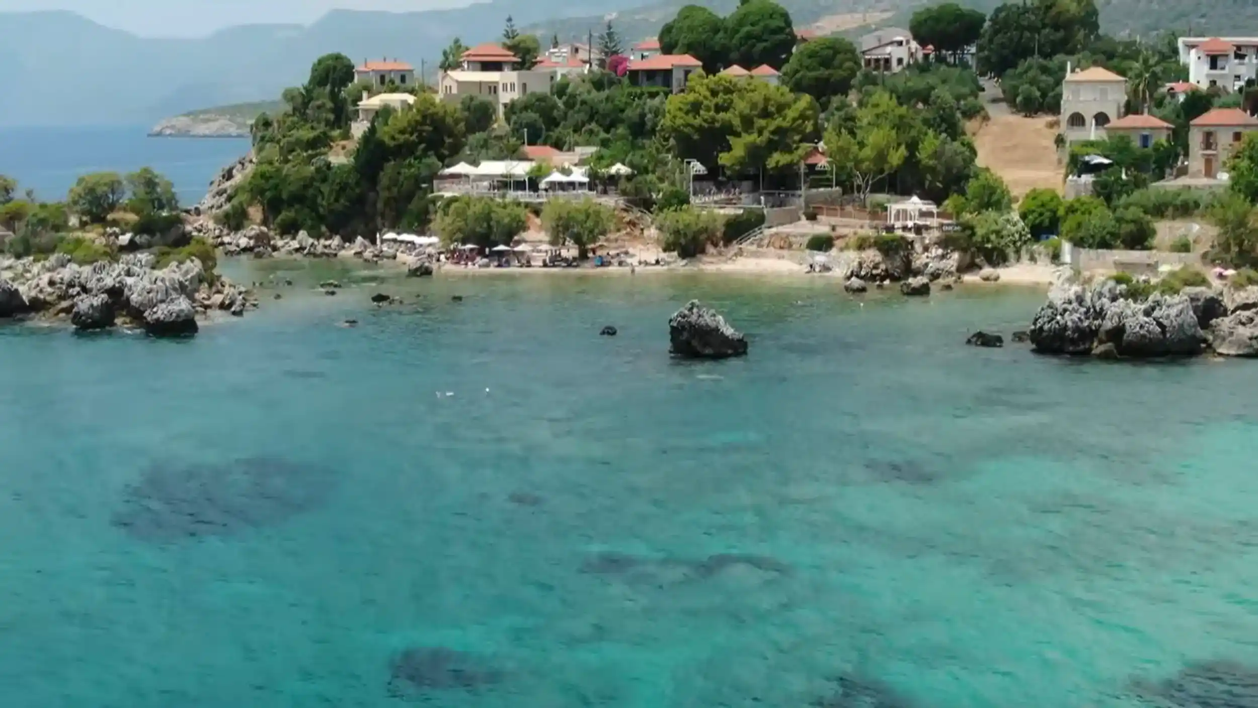 Stoupa waterfront illustrating Stoupa vs Kardamyli coastal village and beach scene.