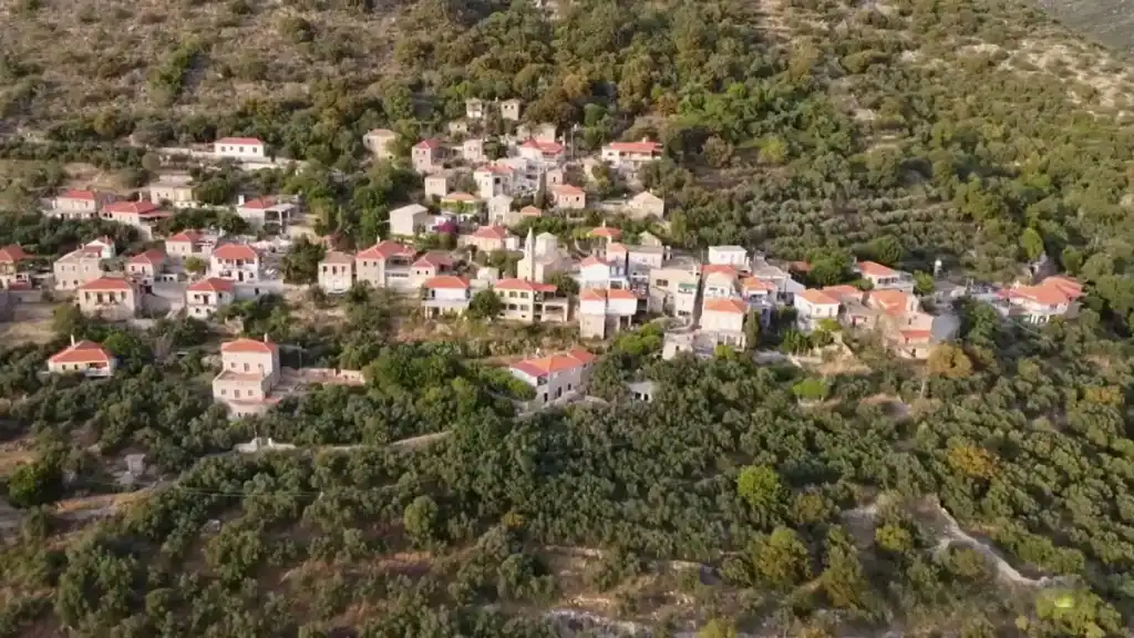 Viros Gorge Kardamyli trail endpoint showing Tseria village on forested hillside.