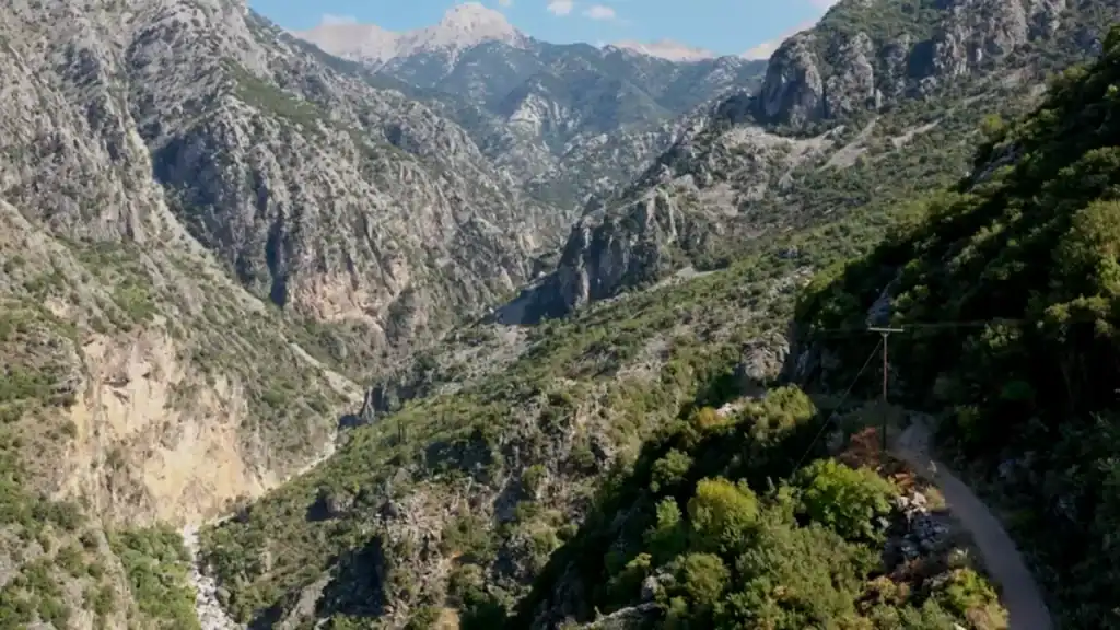 Viros Gorge Kardamyli dramatic canyon with steep rocky cliffs and vegetation.