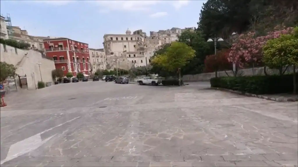 Parcheggio Repubblica in Ragusa, a wide stone-paved car park at the foot of the old town - a practical first stop when driving to Ragusa before heading up into the historic centre.