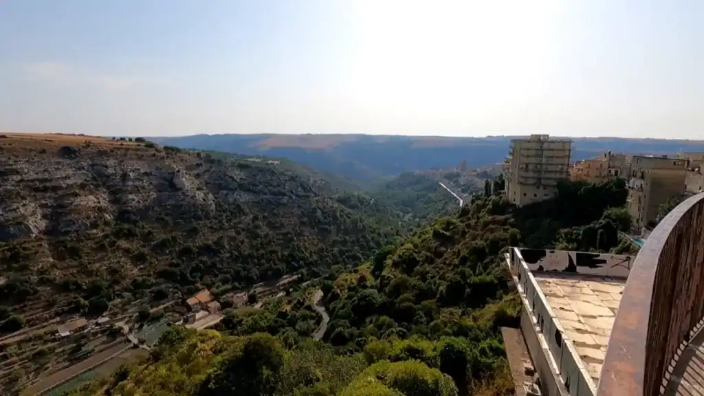 Deeply wooded gorge of the Irminio valley cutting between limestone cliffs below Ragusa - part of what makes settling into Ragusa so tied to the landscape that contains it