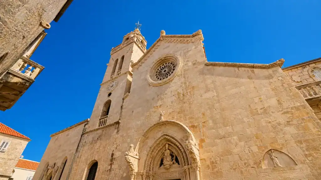 Stone facade and bell tower of St Mark's Cathedral in Korčula Old Town