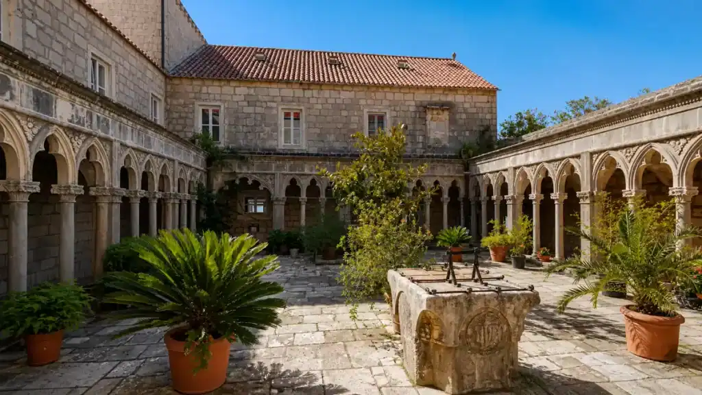 Gothic cloister and stone well at Badija Island Franciscan Monastery, easy to explore from Korčula Town