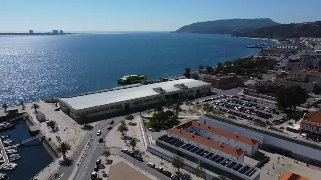 Aerial shot of Setúbal ferry terminal on the Sado estuary with hills beyond
