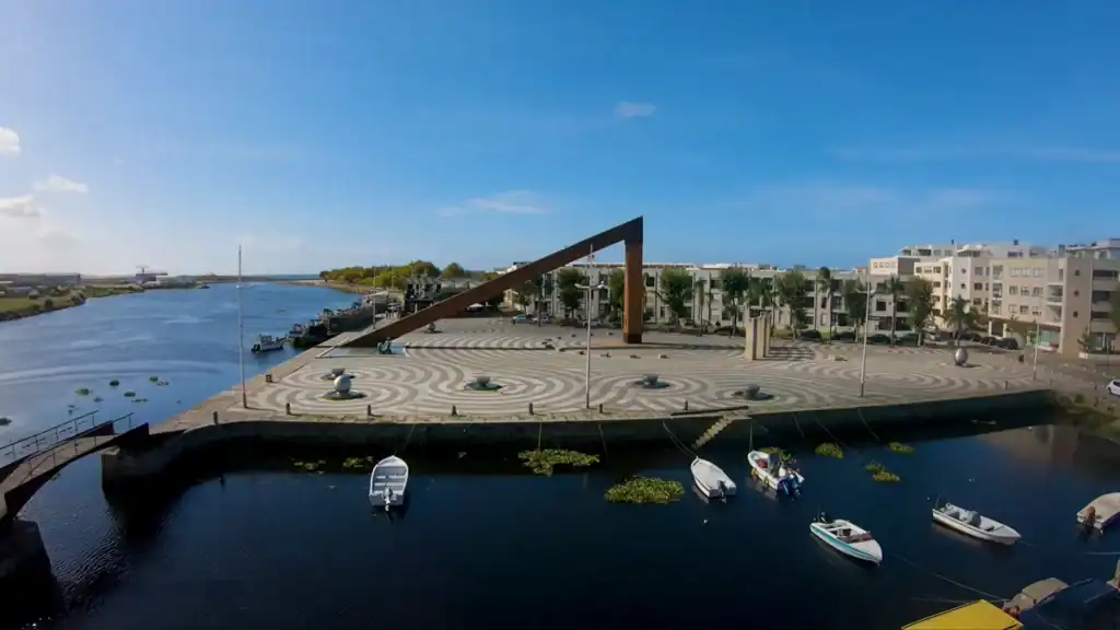 Solar clock sculpture on Vila do Conde cycling route beside the Ave River