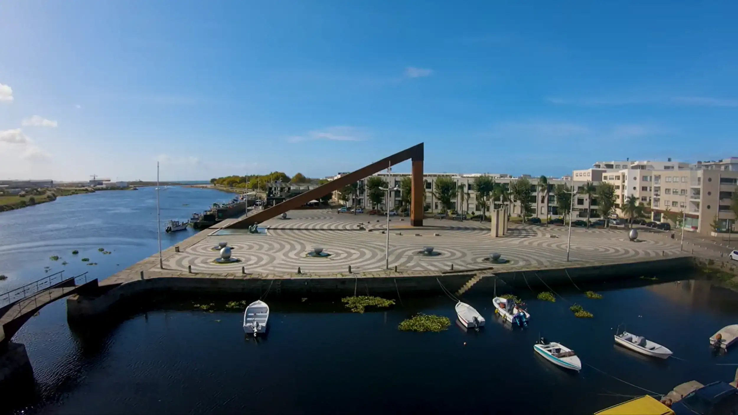 Solar clock sculpture on Vila do Conde cycling route beside the Ave River