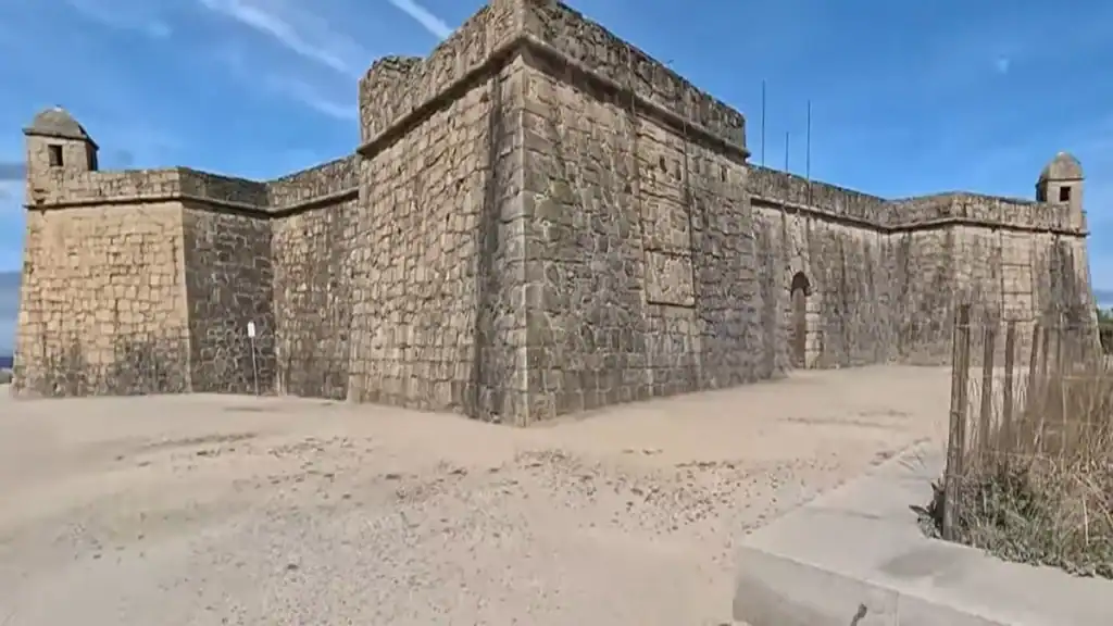 Stone walls and corner turrets of Vila do Conde fort under a blue sky