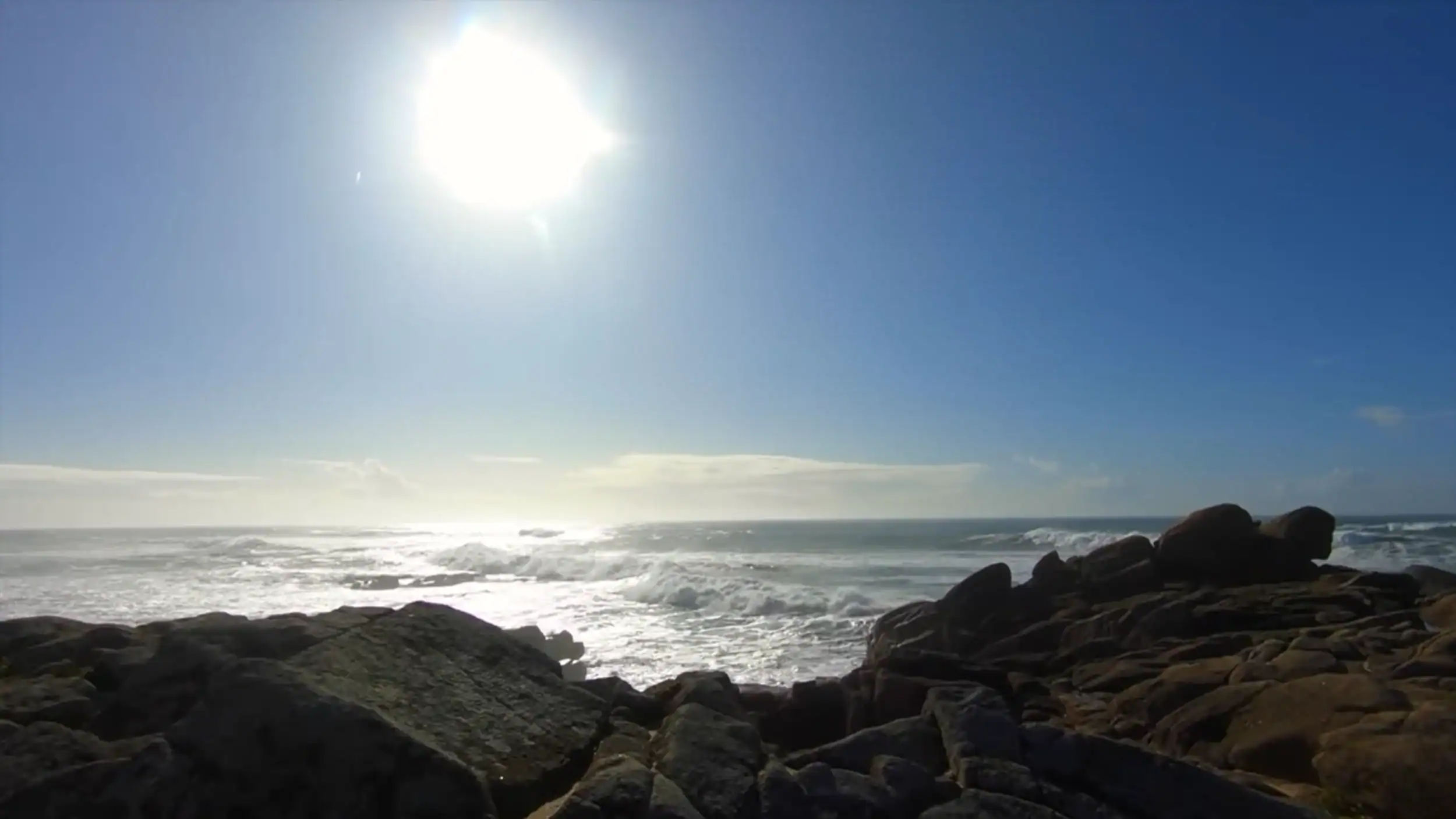 Rocky Atlantic coastline under bright winter sun in Vila do Conde in winter