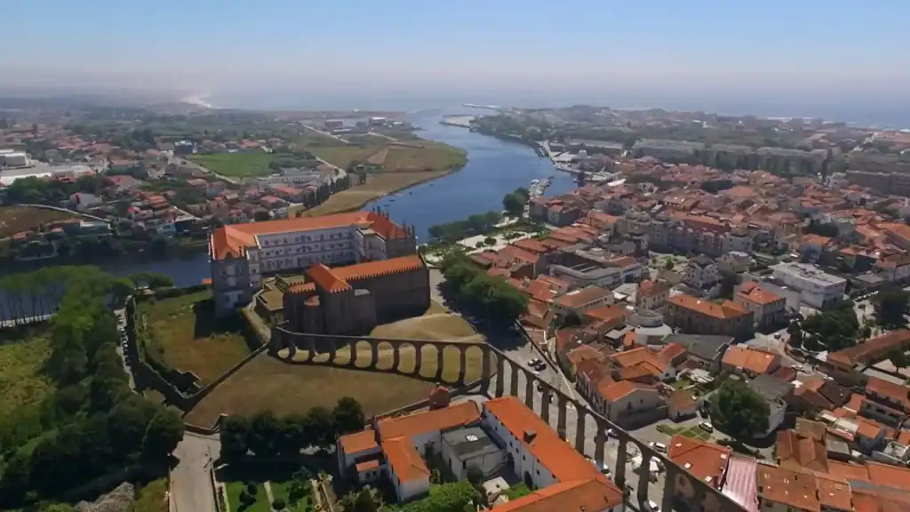 Aerial view of Vila do Conde monastery complex beside the Ave River and its aqueduct