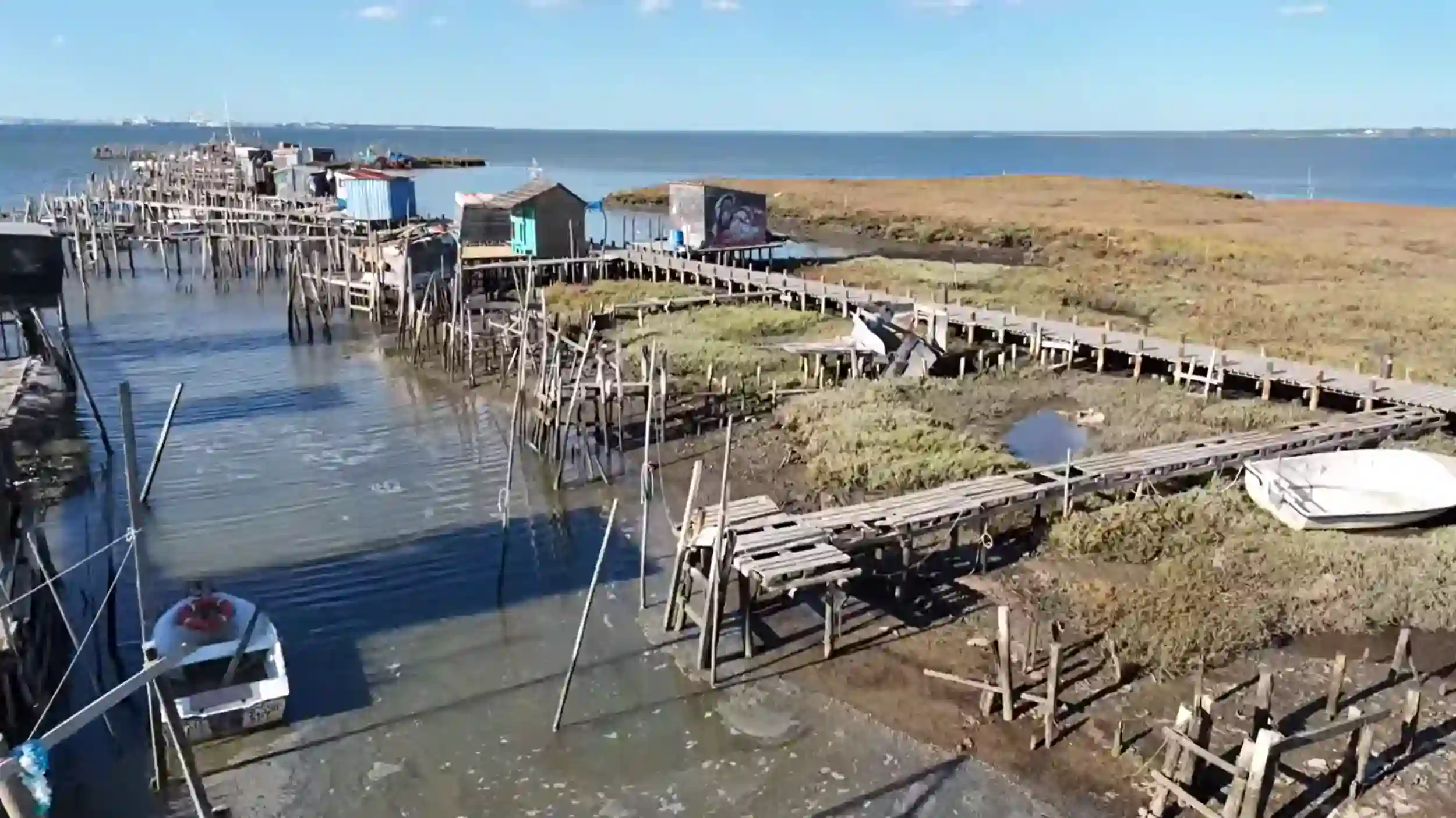 Rickety wooden stilt walkways and fishing huts at Carrasqueira palafitic pier